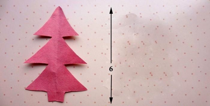 Cut out a Christmas tree from paper