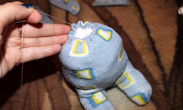sewing a toy