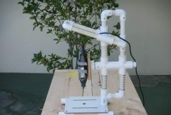 Plastic pipe drilling machine