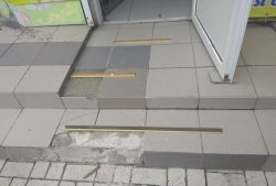 Removing old tiles and laying new tiles on threshold steps