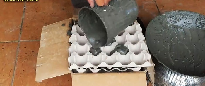 Bloempot gemaakt van cement en eiertrays