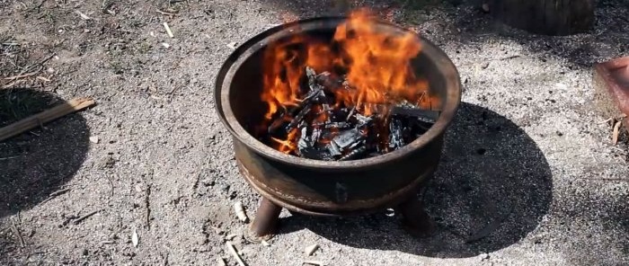 Kā izveidot ugunskuru no vecā riteņa loka