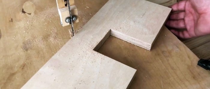 Homemade hand-held plywood band saw driven by a screwdriver