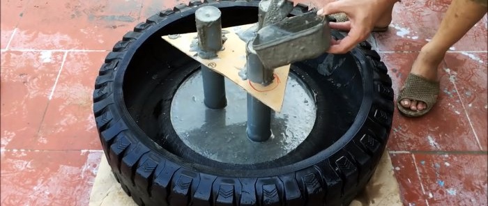Cómo hacer una fuente de jardín de tres niveles con neumáticos viejos