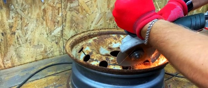 Stand for splitting firewood with a hammer from an old car wheel