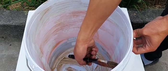 Come realizzare una stufa senza fumo utilizzando cemento e un paio di secchi di plastica