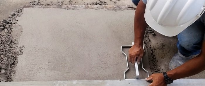 Kaip padaryti antspaudą ir įspaudą po grindinio plokštėmis ant betono